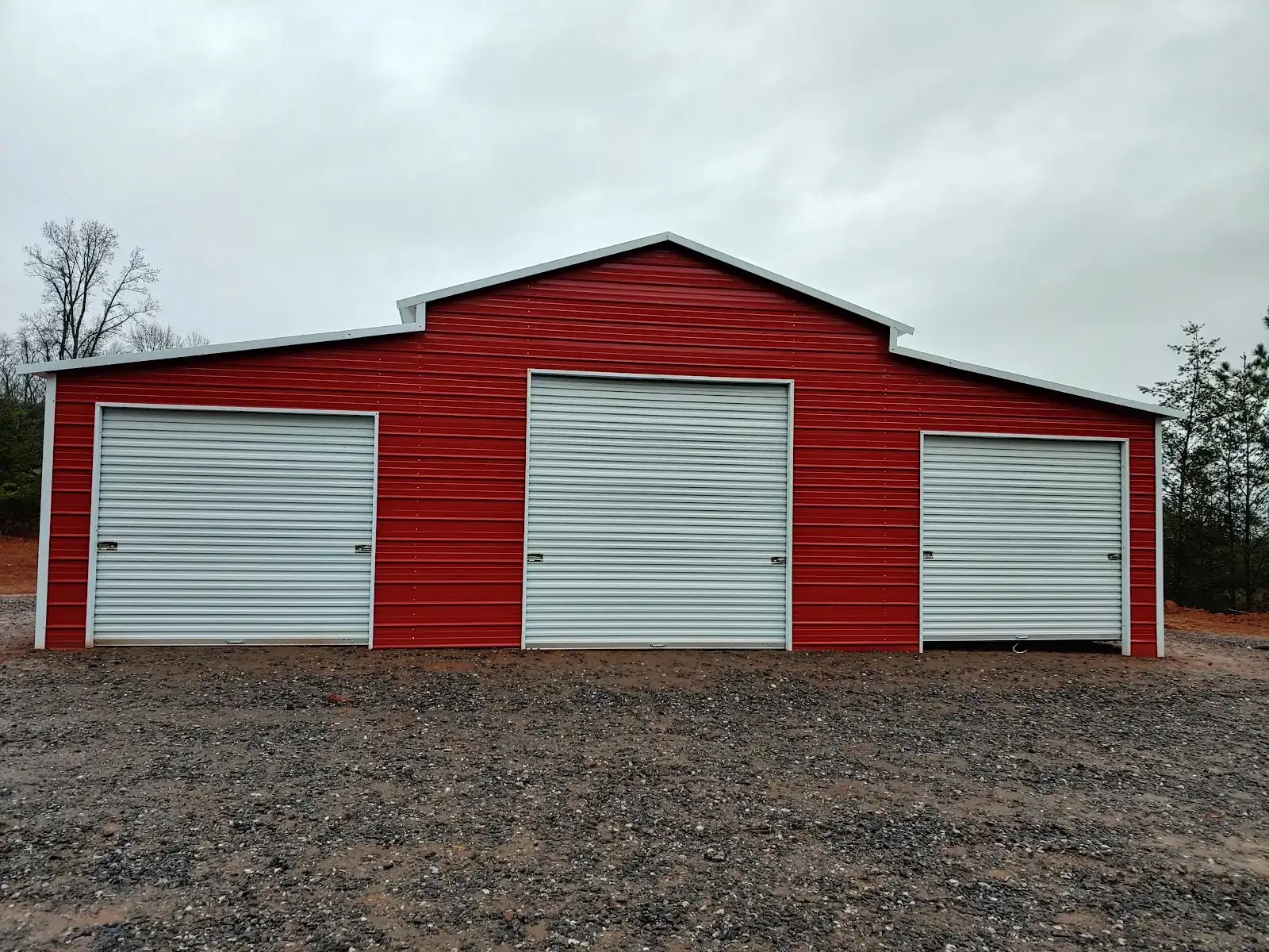 Enclosed metal garage with roll-up doors in Hiawassee, Georgia